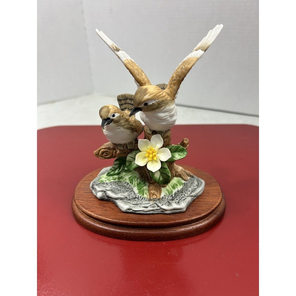 Porcelain Birds Sitting On Tree Stump On Wooden Base